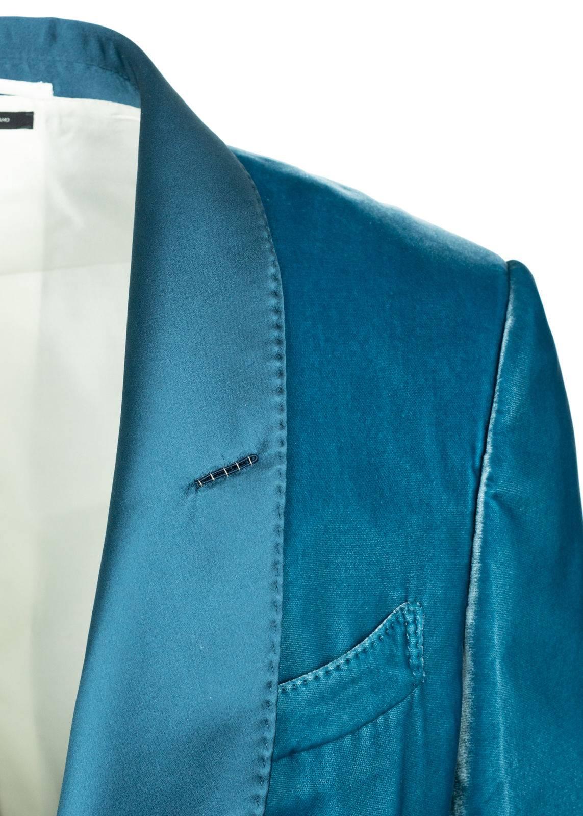 nvite all pleasurable eyes in with your Tom Ford Velvet Jacket. This strikingly smooth Shelton features a satin shawl lapel, silk blended interior, and concealed sleeve hem closure. You can pair this suave unit with and all white ensemble for