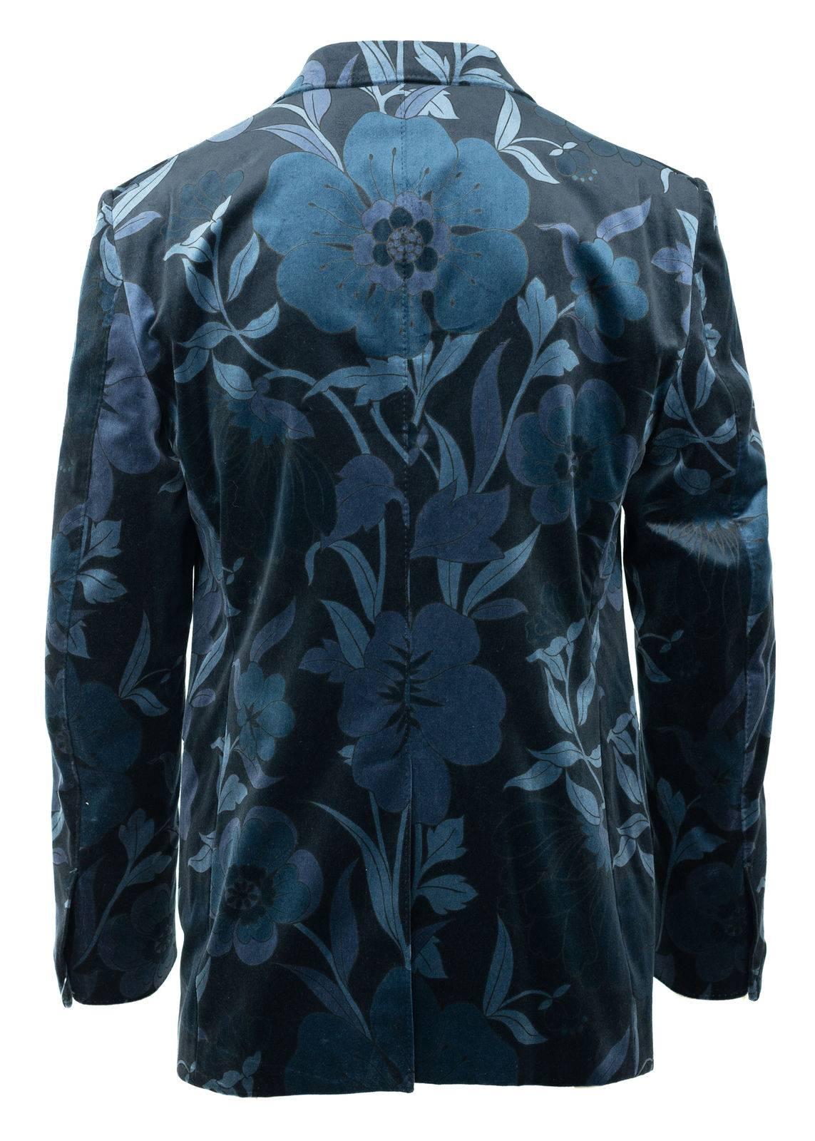Showcase your sublime appreciation for nature in your Tom Ford Velvet Jacket. This cool blue Shelton features a surreal floral design, silk blended interior, and concealed sleeve hem closure. You can pair this suave unit with and all white ensemble