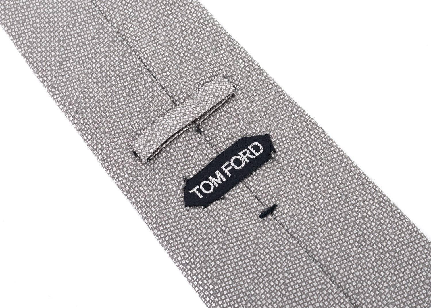 talian luxury brand, Tom Ford, has crafted these gorgeous 100% Silk Tie for important special occasions and professional events. The tie is great to pair with your favorite solid color button down and blazers with your chosen pair or classic