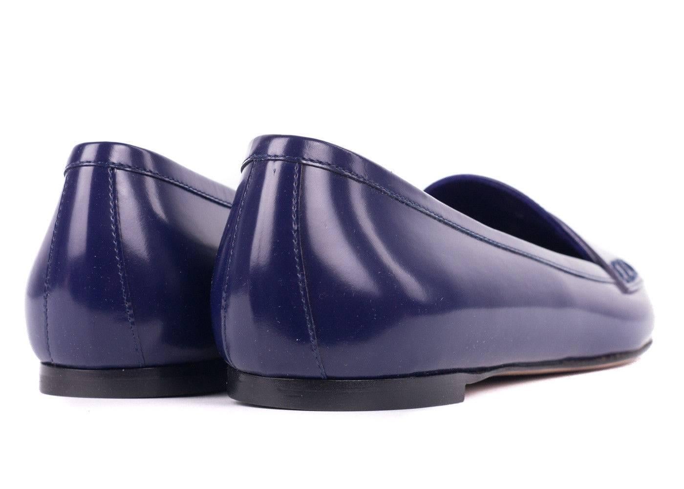 Gianvito Rossi's update to the classic penny loafer is a modern treasure. This purple ballerina flat features the penny bar, pointed to silhouette, and superbly polished leather. You can pair these flats with a slim all black sheath dress for a