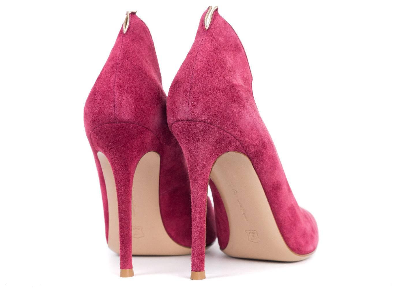Introduce the High Back Heel from Gianvito Rossi's into your wardrobe. This pink suede pump features, light gold trim, a slightly split heel count, and a four inch heel. You can pair these heels with an all white skinny trousers and a fluid blouse