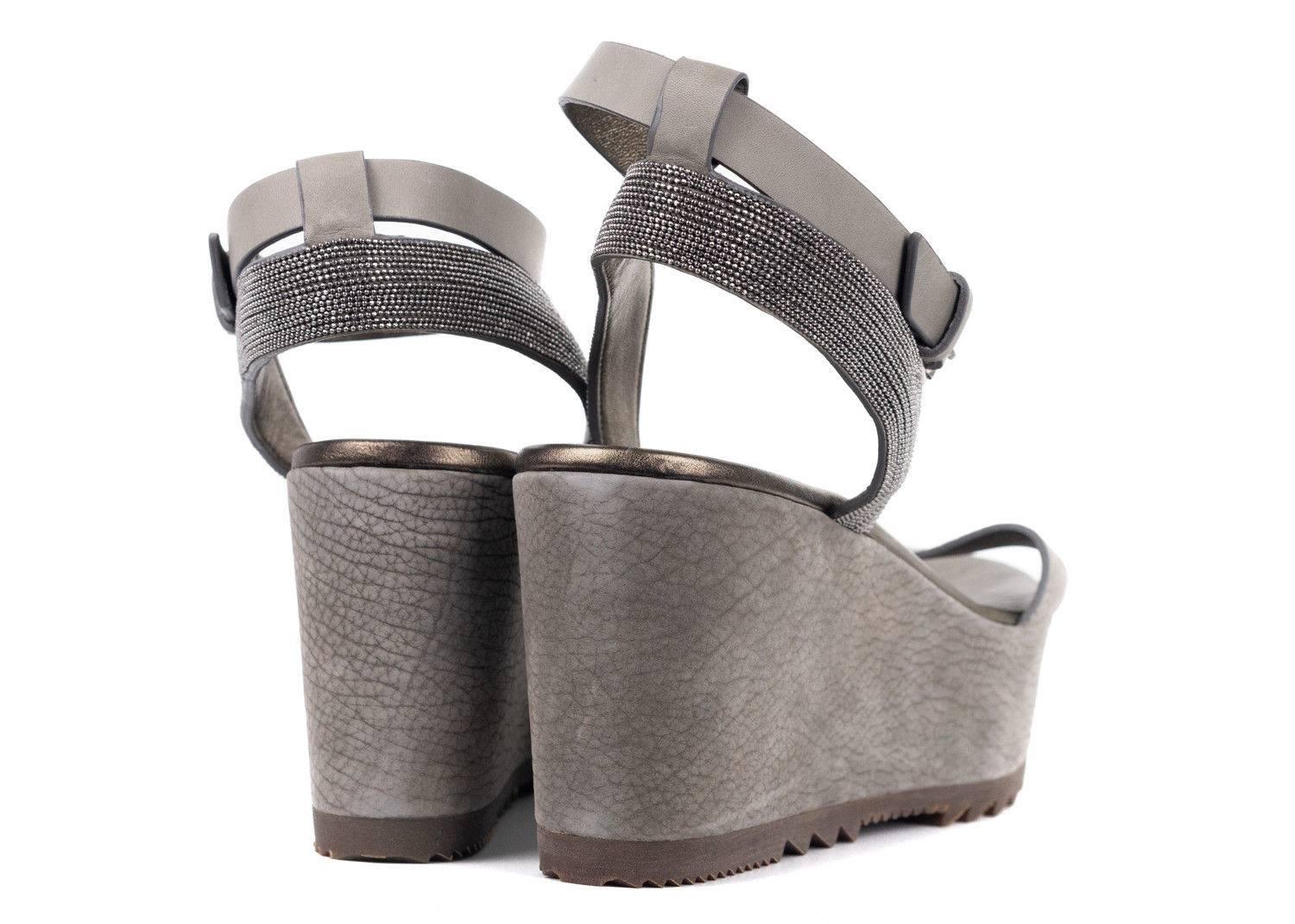 Brand New in Original Box with Dust Bag
Retails in Stores and Online $1305
Size 41 / 11 Fits True To Size

These beautiful Brunello Cucinelli Leather Platform Wedges features a Monili Ankle Strap  and Distressed Grey leather Design. These Luxurious
