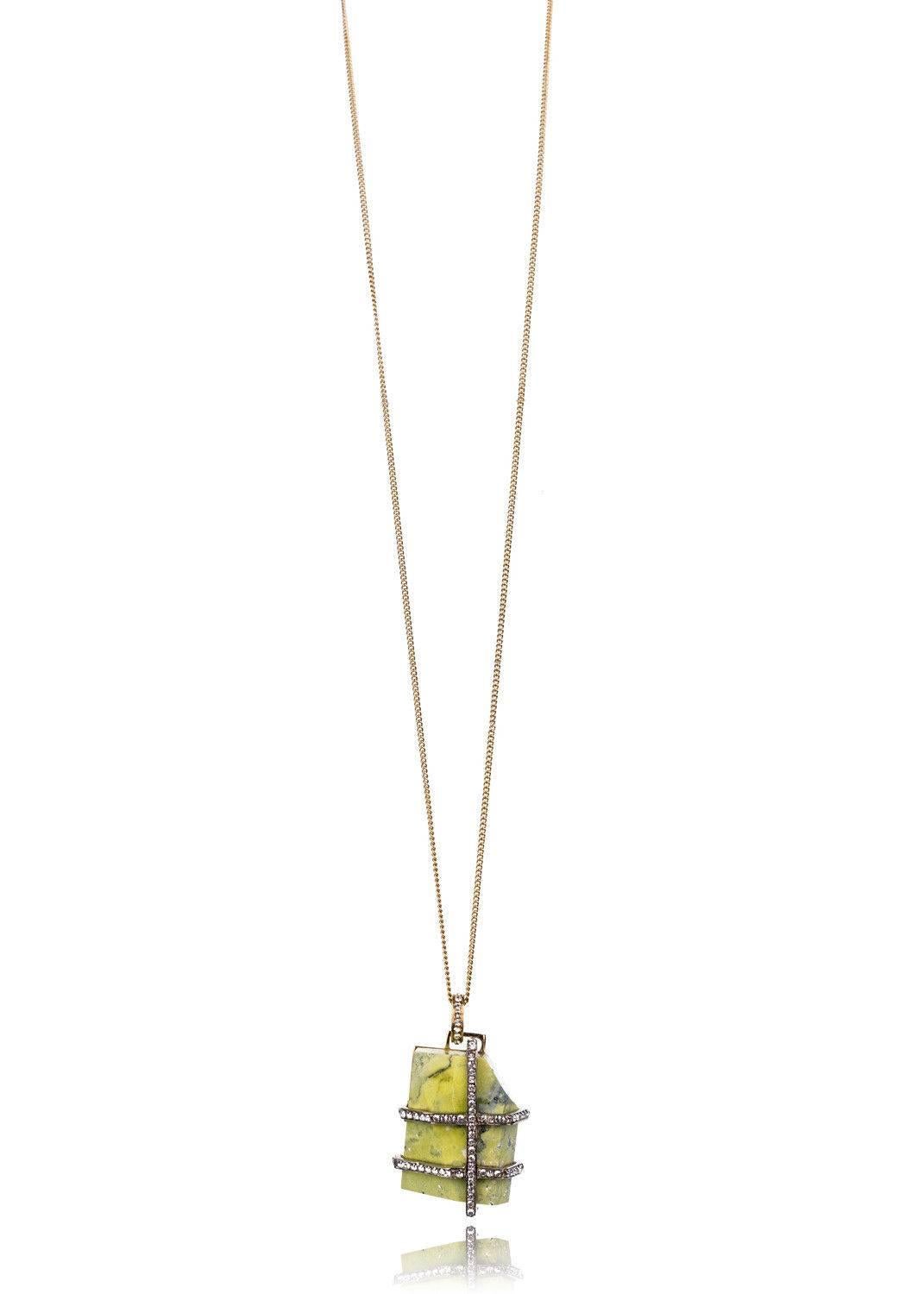 Roberto Cavalli's Green Marble necklace will be your calming earthy accessory of the day. This necklace features a faintly luminous green marble stone, Swavorski Crystal accents, and a bold gold frame. This thin gold tone chain adds a lightly casual