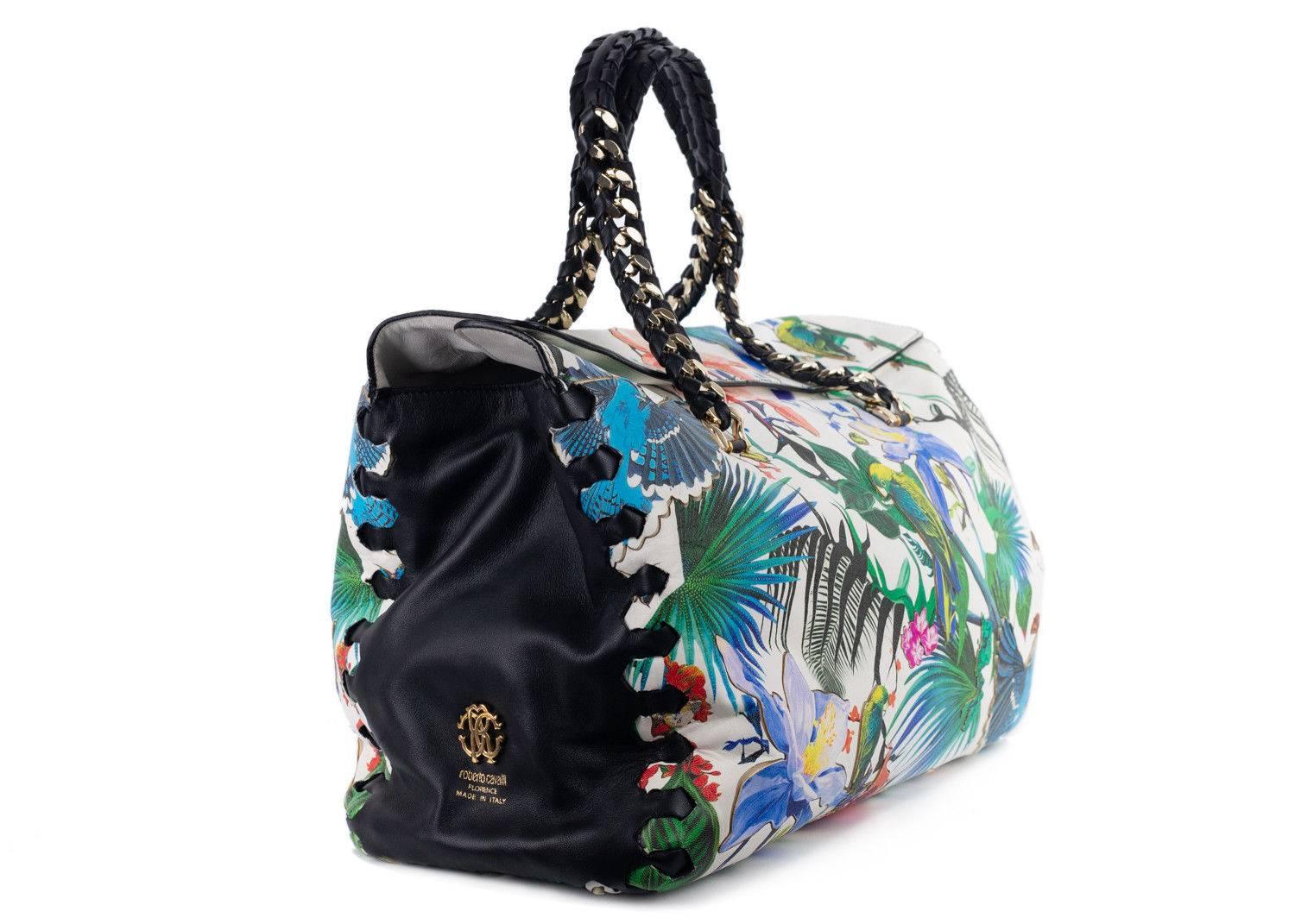 Roberto Cavalli multicolor leather tote bag. This tote bag features a theme of tropical and floral print of birds, flowers and trees. This large bag is great to store all your essentials in for your everyday lifestyle. Pair it with simple denim
