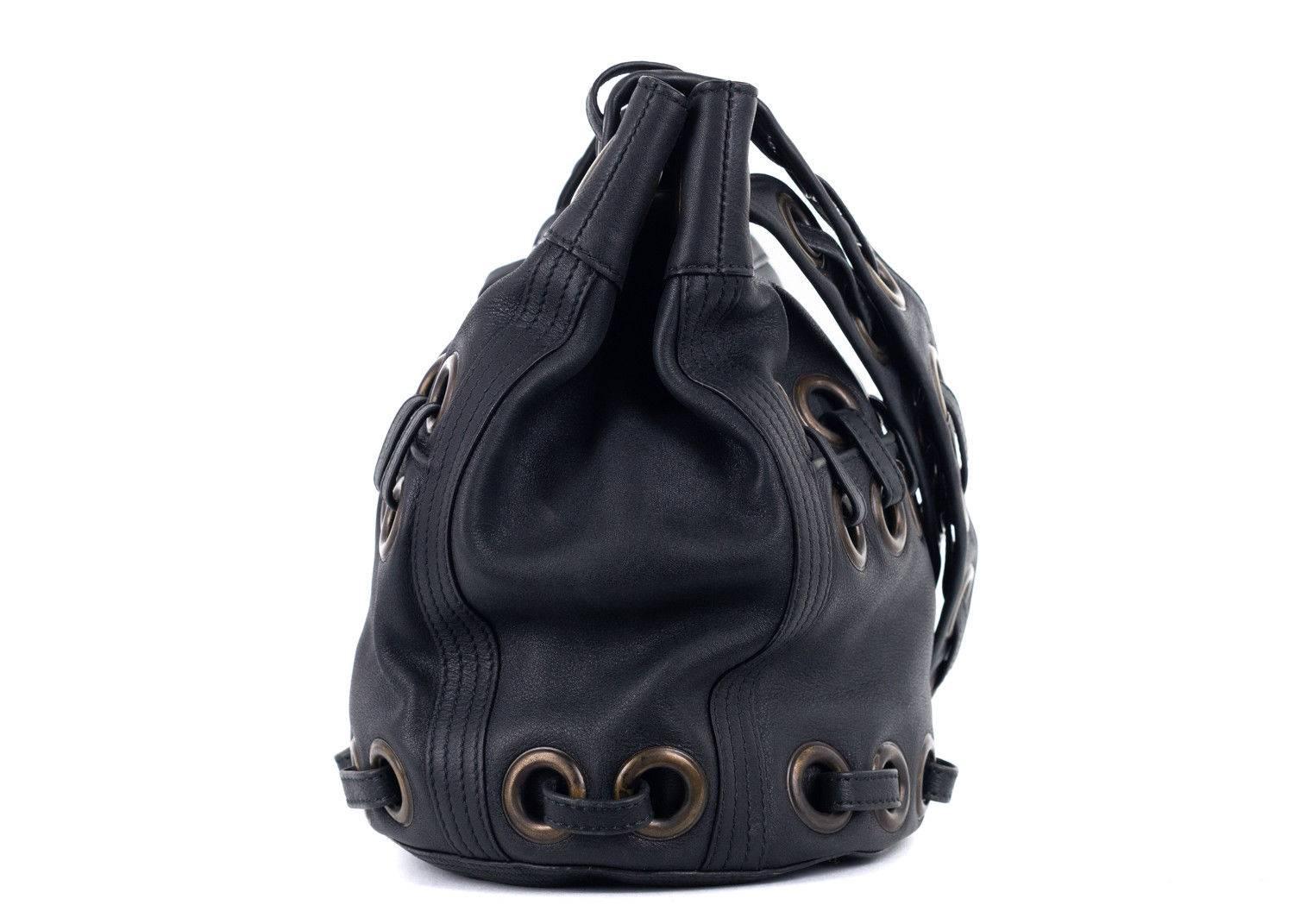 oberto Cavalli solid dark greay leather bucket tote bag. This bag features large eyelet detailing with dark toned hardware. Spice up your everday style with this edge tote bucket bag by wearing simple denim and chic blouse.

 

Leather
Large Eyetlet