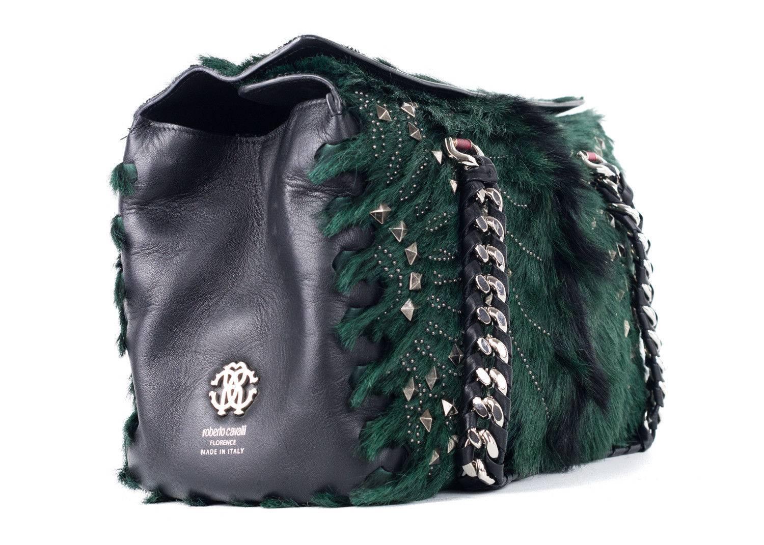 Regina Medium Green and Black Radiant Studded Satchel Bag crafted in richly dyed goat hair and lambskin leather lends a boho chic style with its soft lines and radiant pyramid and pindot studs. Featuring inlaid chain and leather handles internal zip