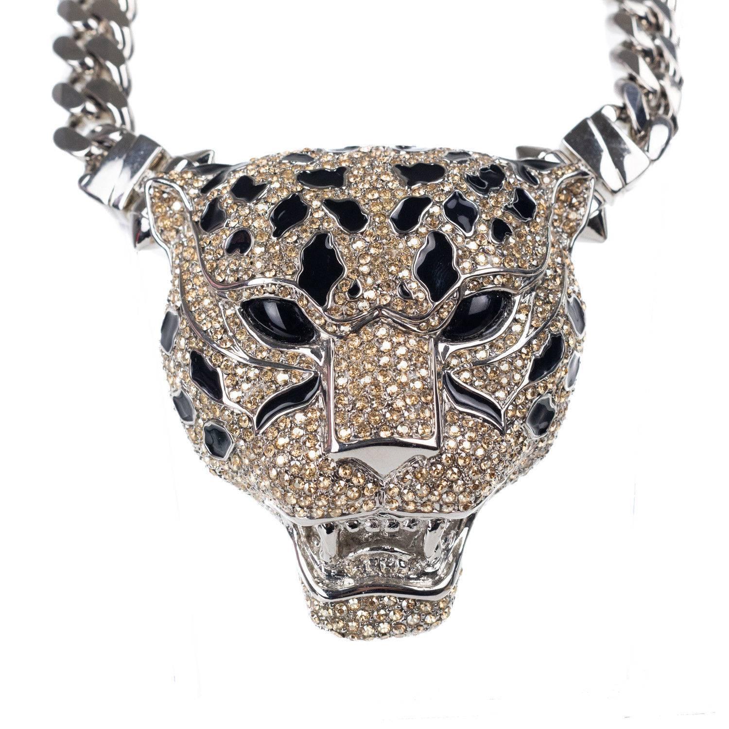 Sparkling with pavé Swarovski crystals Roberto Cavallis silver plated brass panther necklace is enameled with black resin and has bright red eyes. Statement but not too weighty this chunky piece secures with a sturdy chain to sit comfortably around