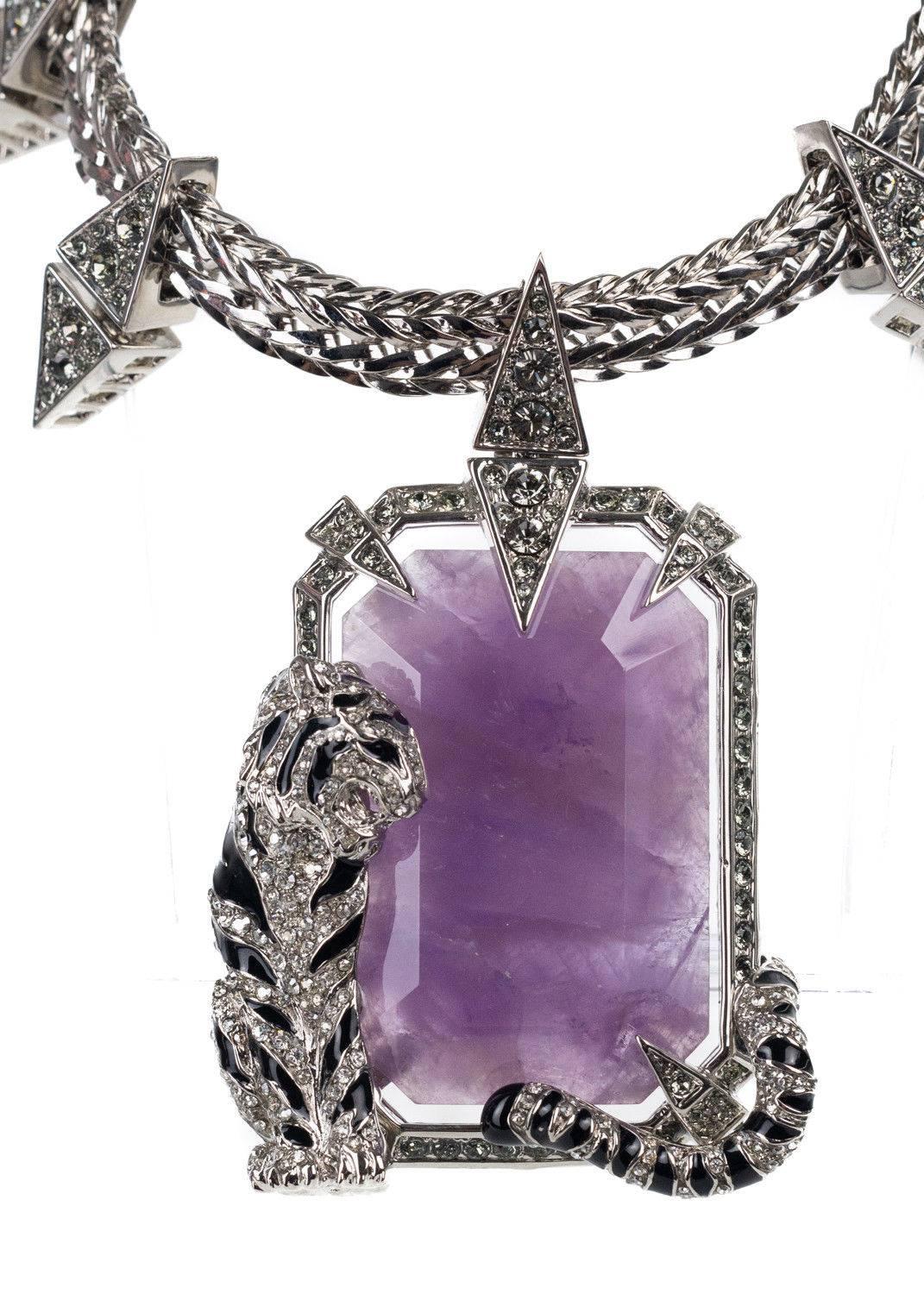 Roberto Cavalli silver plated necklace. This necklace features a purple stone with a black enamel and swarovski encrusted detailing tiger. Perfect for a statemented look, style itw ith a solid plan top for this beauty to pop.

 

Brass and Swarovski
