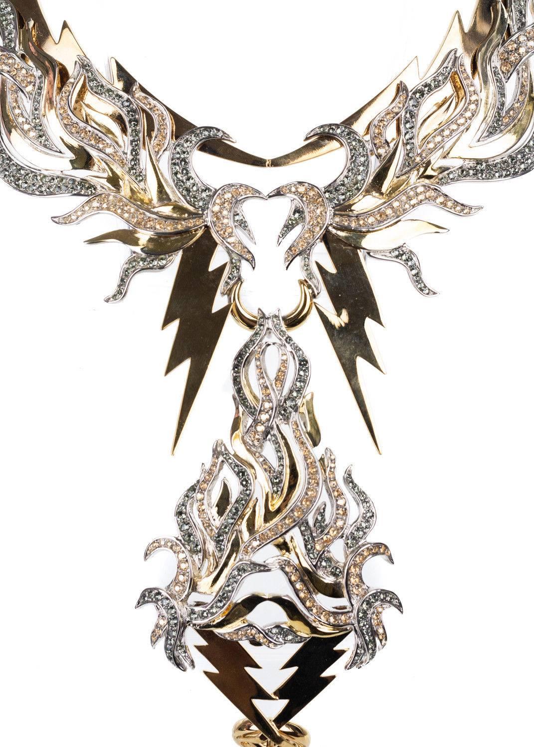 Roberto Cavalli gold plated statement necklace. This neckace features gold lightening bold design encrusted with swarovski crystals throughout. This piece is a great statement necklace to wear for a stand out look. Pair it with a deep v black dress