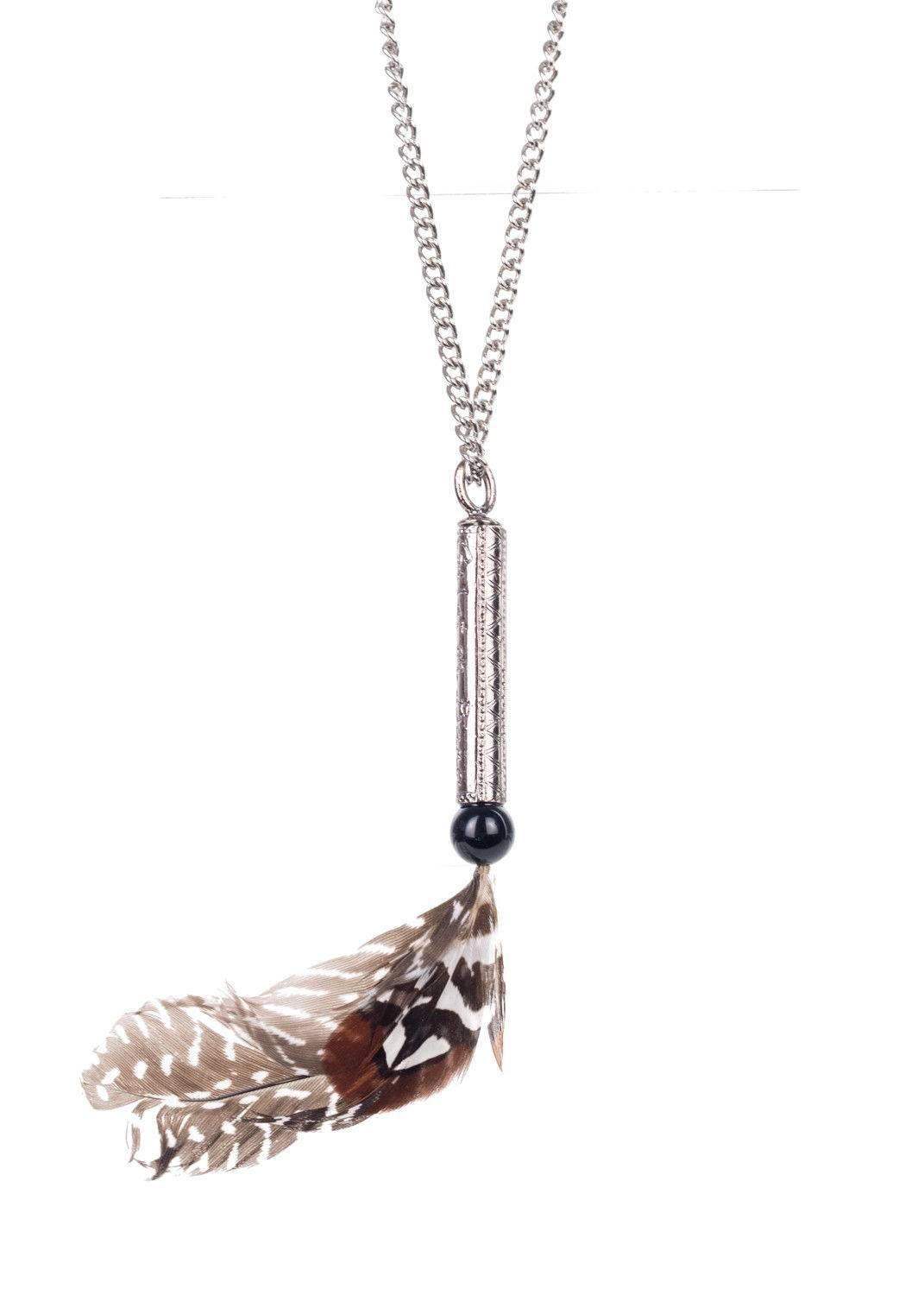 Roberto Cavalli silver plated long necklace. This necklace features a long silver chain adjustable with a lobster clasp designed with a feather and black enamel circle design. The necklace is a great edition to a maxi floral dress for a boho chic