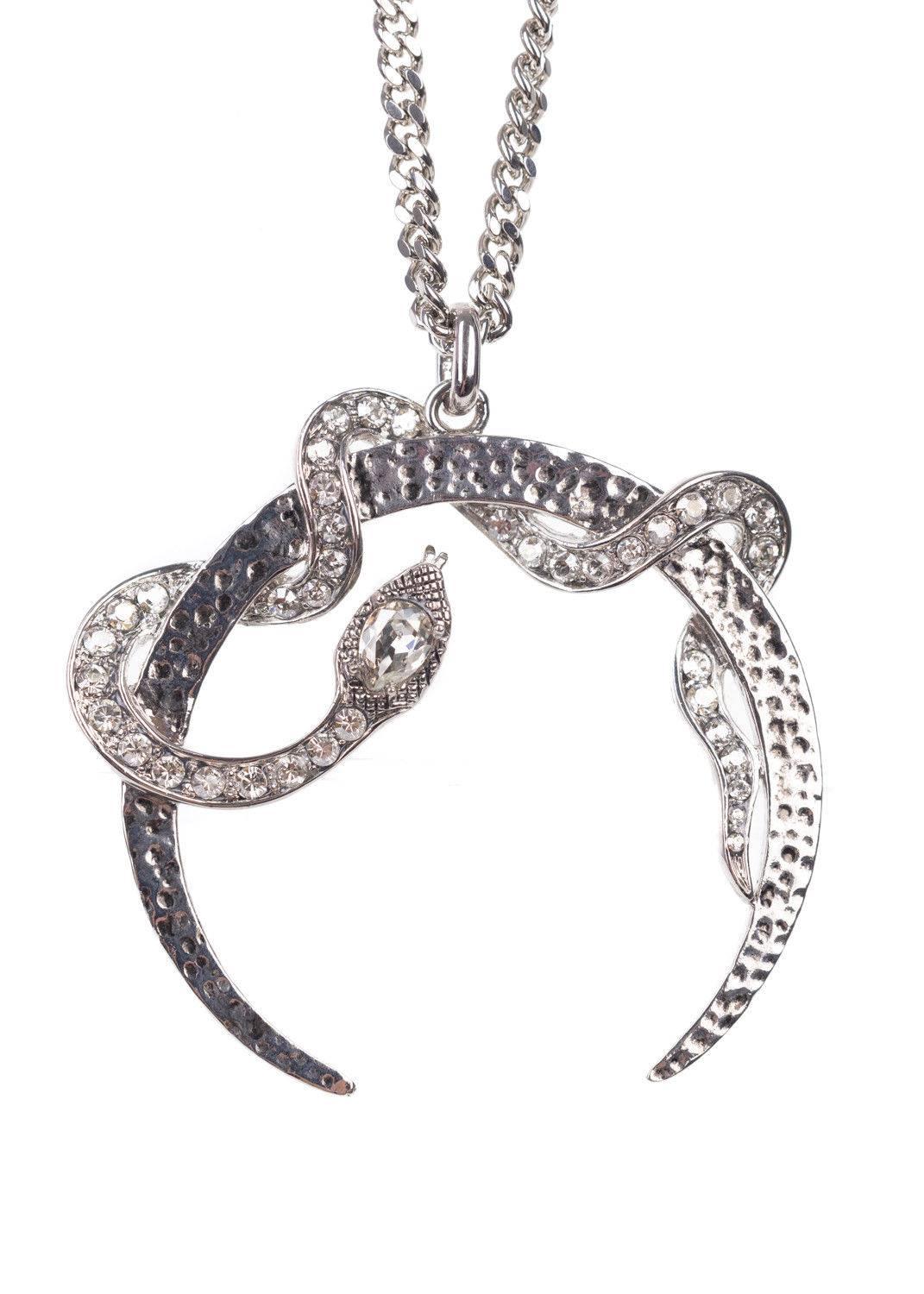 Roberto Cavalli silver plated necklace. This necklace features a half moon design with a swarovski encrusted serpent. This necklace is great to pair with a deep v neckline silhouette for a statemented chic look.

 

Brass and Swarovski