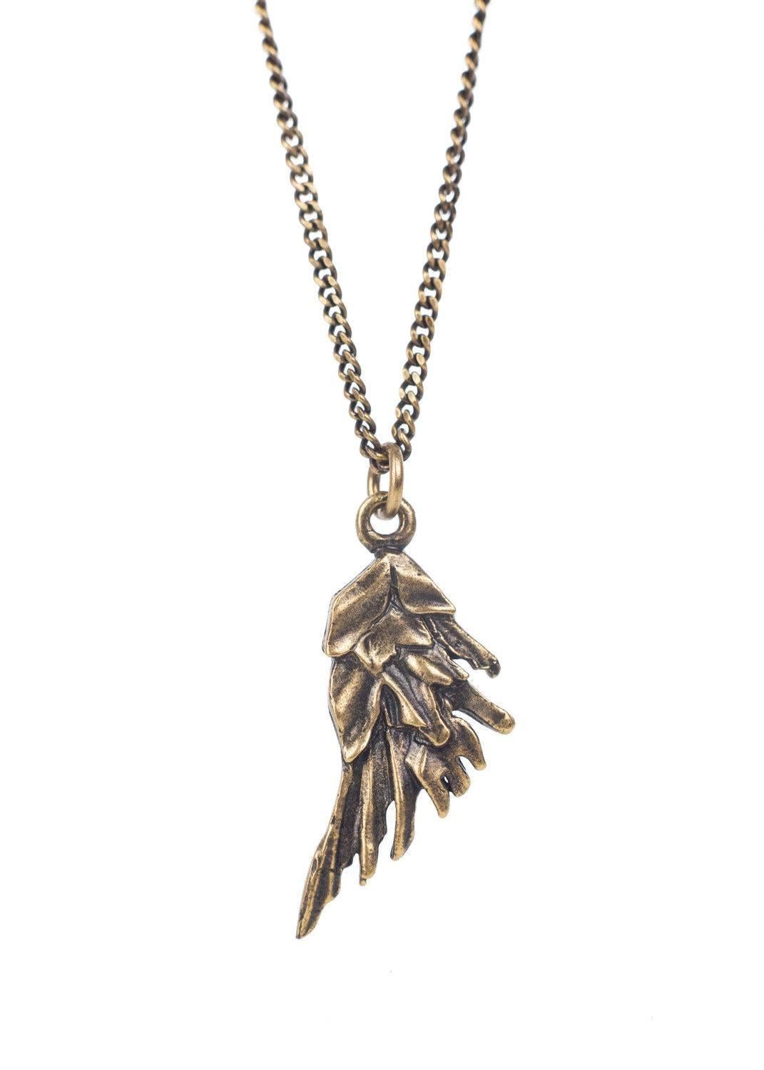 Get your Roberto Cavalli Necklace for the ultimate win. This necklace features a thin antique gold chain, small wing pendant, and tonal gold circular appliques. You can pair this necklace with a deep v neck dress and go. 

11 inch Length
1 inch