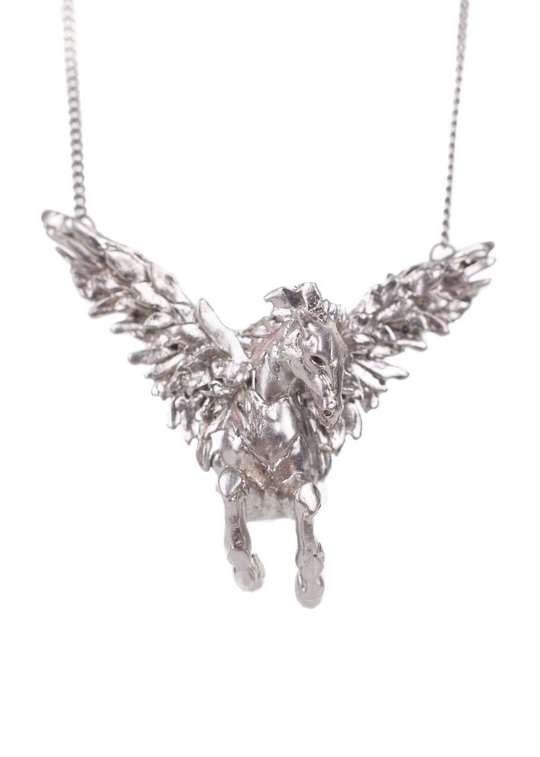 Get your Roberto Cavalli Necklace for the minimal decadence. This necklace features a thin silver chain, soaring horse pendant, and tonal circular appliques. You can pair this necklace with a basic t shirt and skinny jeans and go.

11 inch Length
1