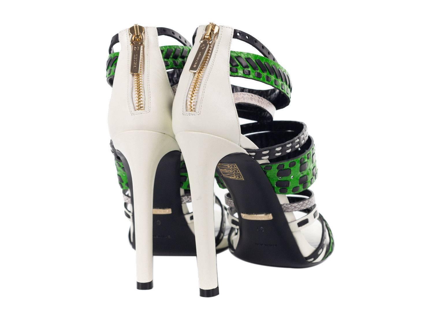 The artistic women decorates all canvases in her Roberto Cavalli Heels. These edgy beauties feature starking multi texture caged straps, black tribal leather stitching, and a calm white base. You can pair these snake texture infused heels with a red