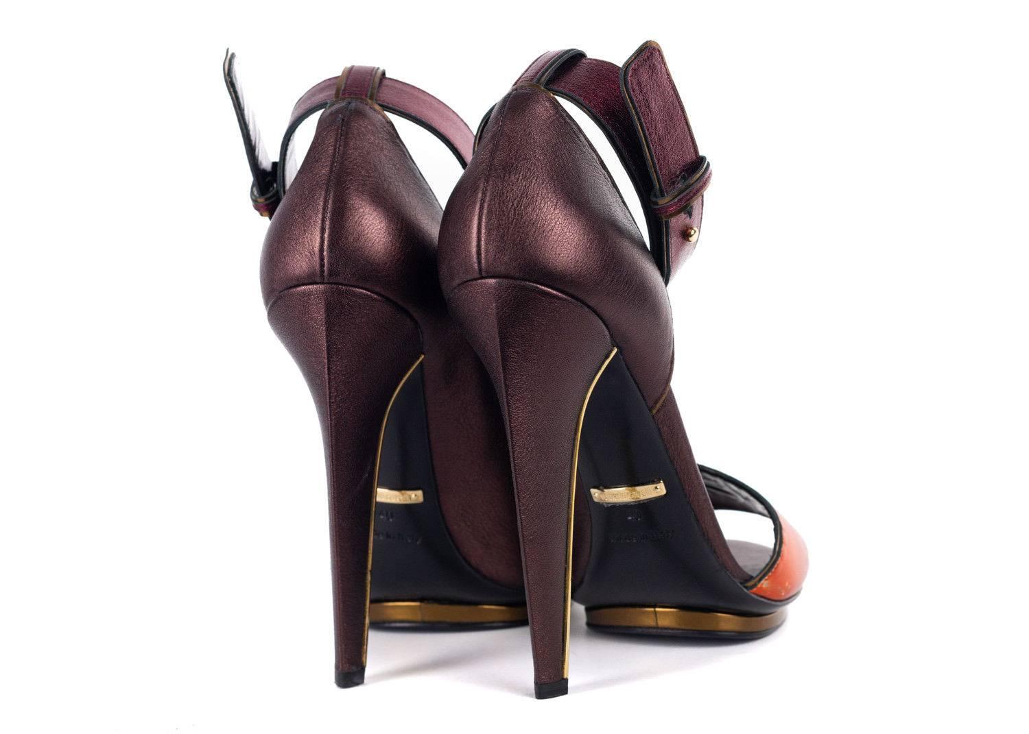 New without Original Box

Retails in Stores and Online $185

Size European 40 US 10 Fits True To Size

the unforgettable statement in your Roberto Cavalli Pumps. This smooth shoe features rich Satin Brown,red, and orange leather, Gold striped
