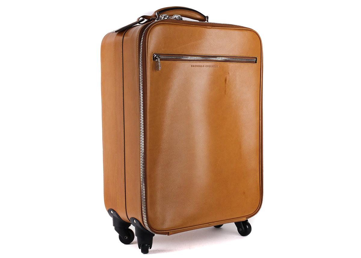 Crafted by artisans in the hills of Solomeo, Brunello Cucinelli's trolley suitcase bag is an example of impeccable workmanship. Perfect size for traveling to store clothes and other essentials on a vacation or business trip.

Leather
Zip