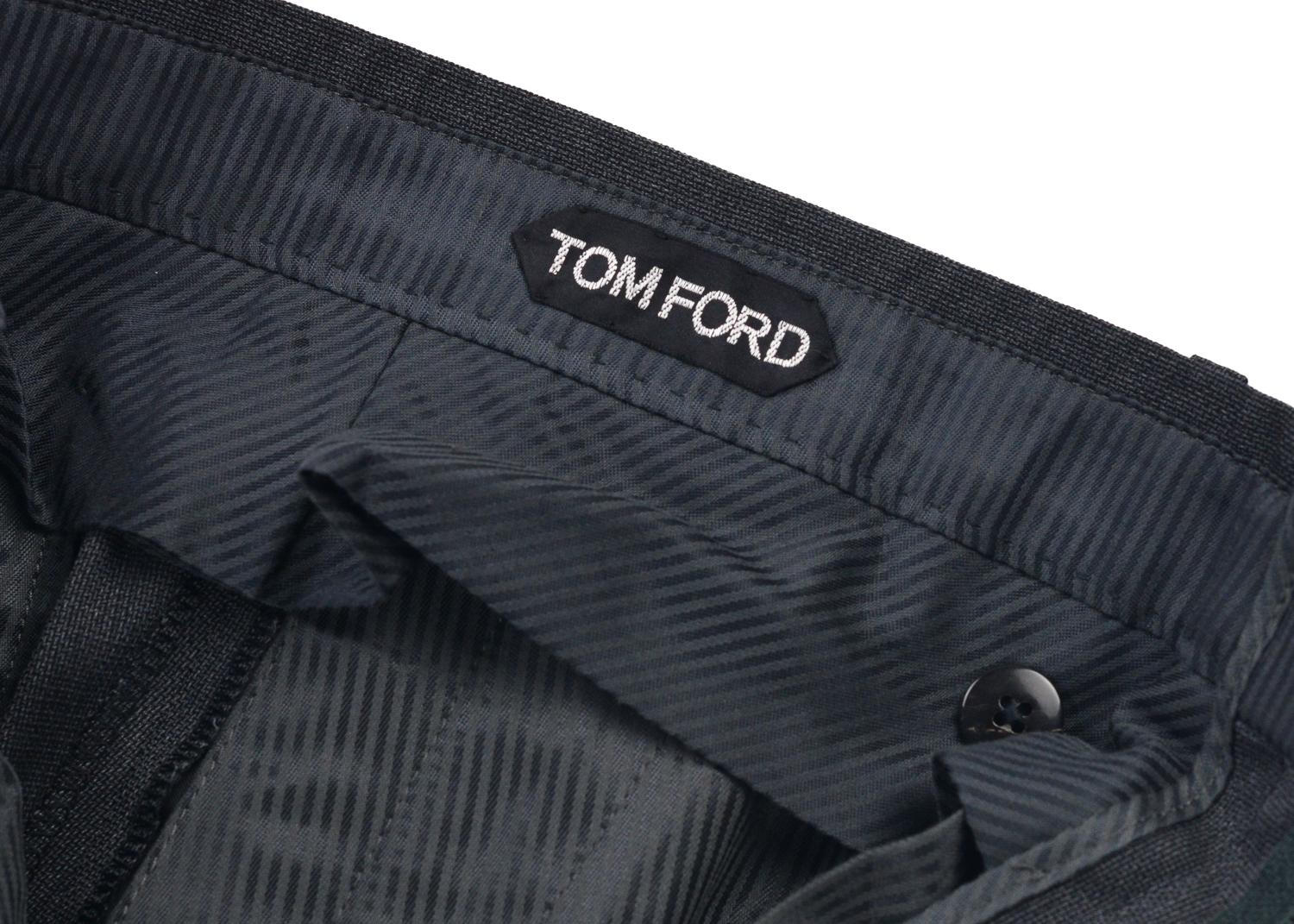 Display your effortless refinement with your Tom Ford Twill Trousers. These pants feature rich deep grey twill wool, pleated front, and concealed cuff hem. You can pair these trousers with a button down for the classic professional