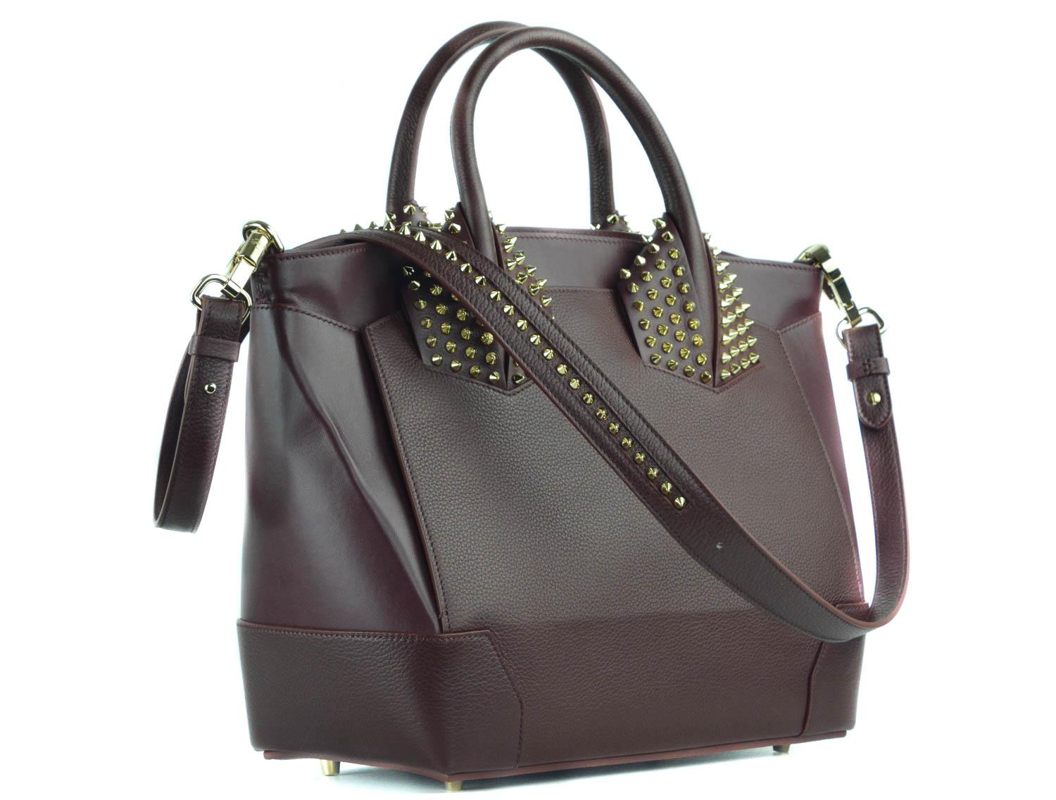 Sport one of Louboutin's signature collectors with your Large Eloise Handbag. This bag features a top zip closure, spike studded handle base, and luxurious grained calfskin leather composition. This bag can be taken into the office or out on the