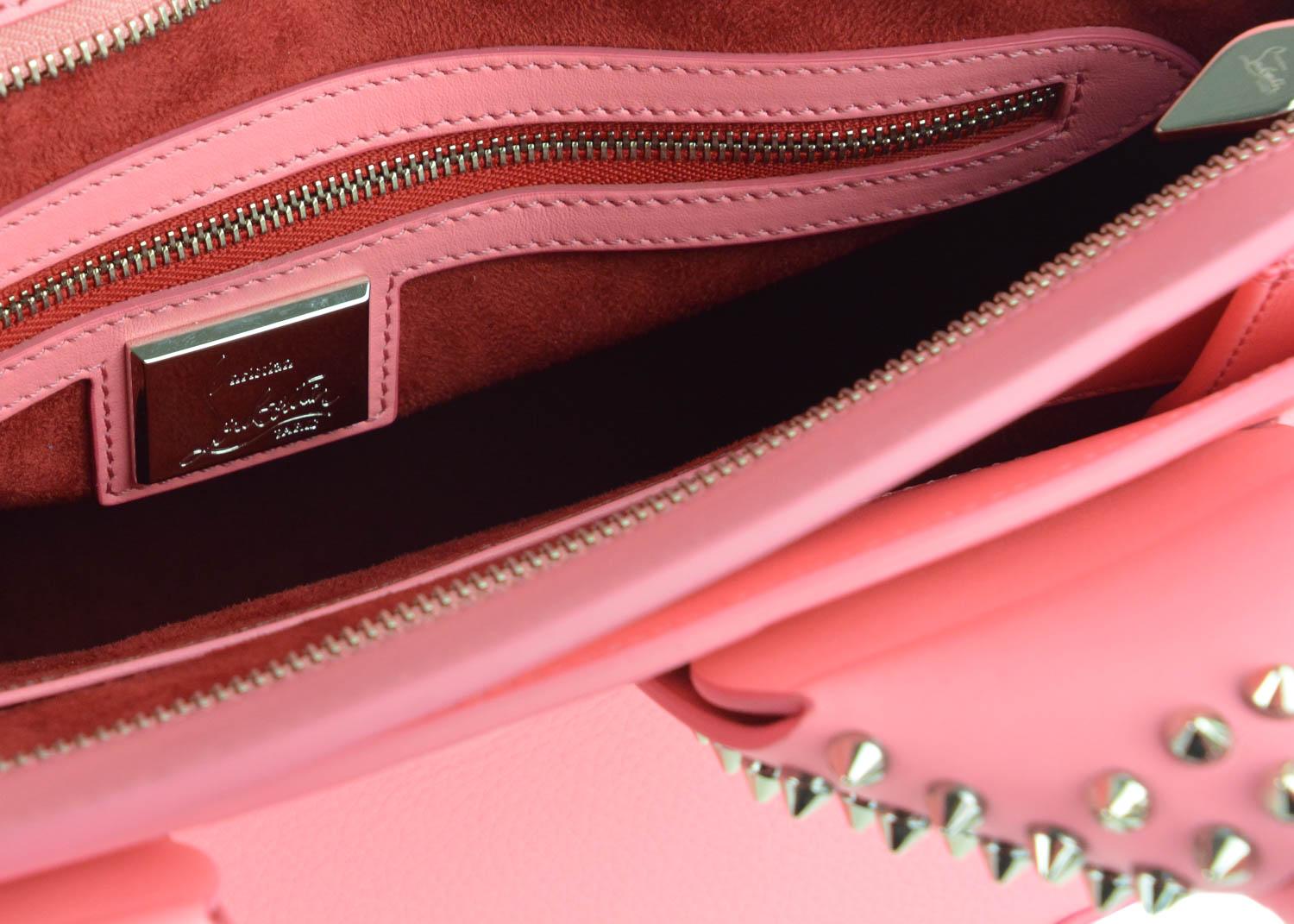 Christian Louboutin’s Eloise bag is crafted in Italy from grained calf leather in a rich Pink hue – complemented beautifully by the signature gold-tone spikes. This structured style has plenty of space for your wallet, smartphone, and make-up