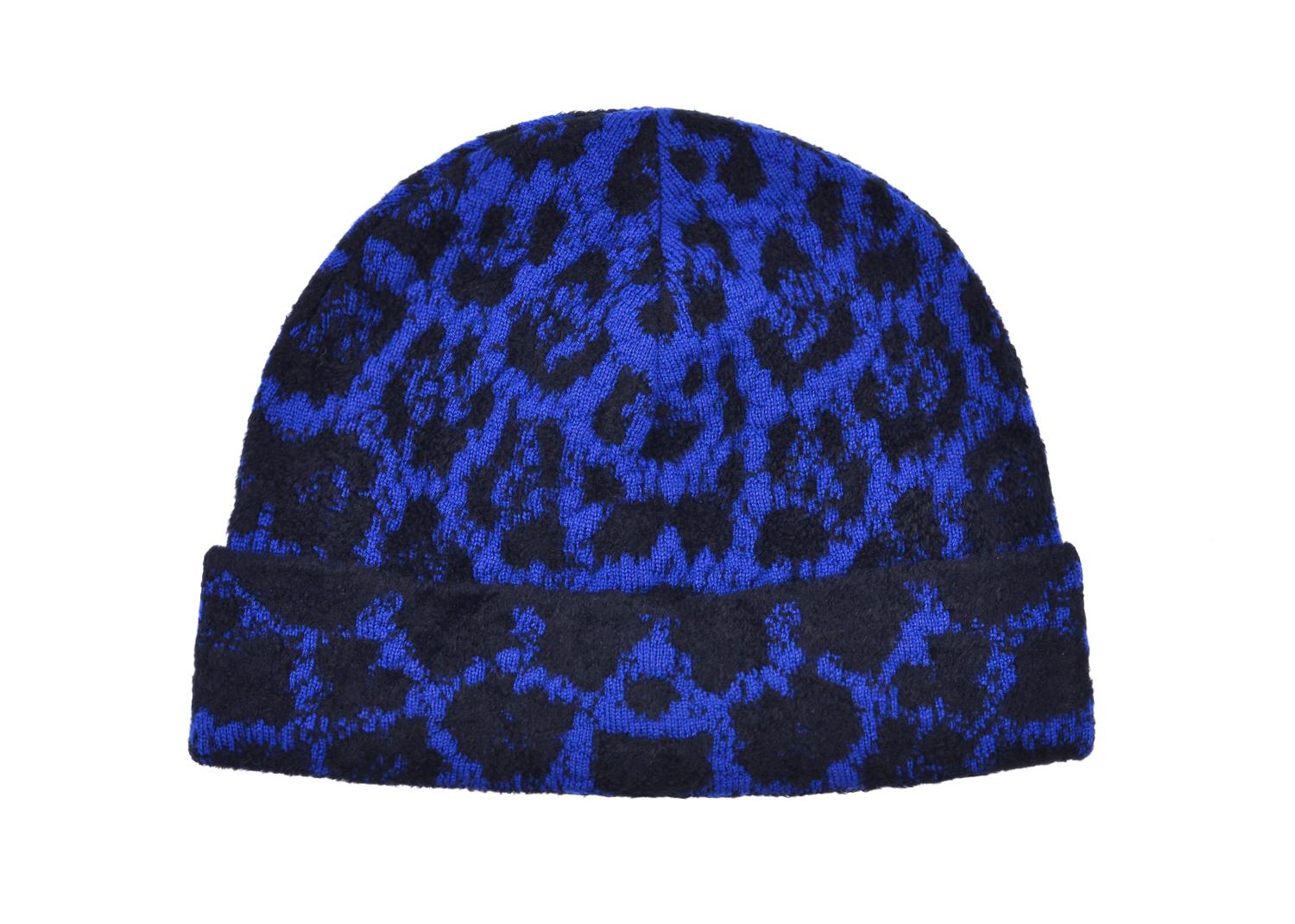 Roberto Cavalli redefines classic print infusion with this wool blend masterpiece. This deep electric blue and black hat features black multi woven cheetah print, a knitted electric blue base, and modern cuff base. You can slip this over your head