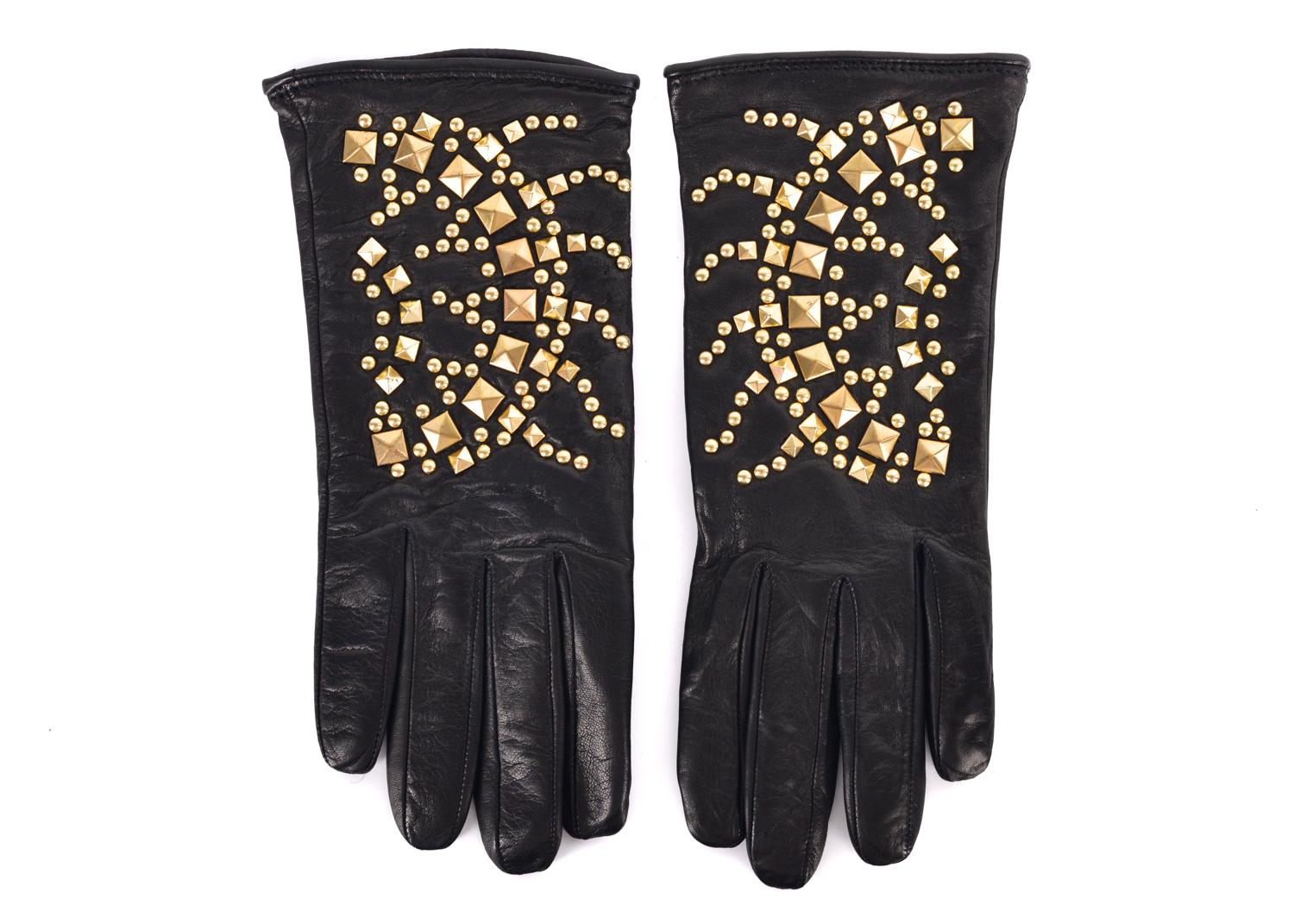 Cavalli reintroduces the heat into your winter with these Gold Studded Gloves. This pair features high quality luxe leather, a rich wool interior lining, and delicately polished gold toned cones and studs. You can pair these gloves with the perfect