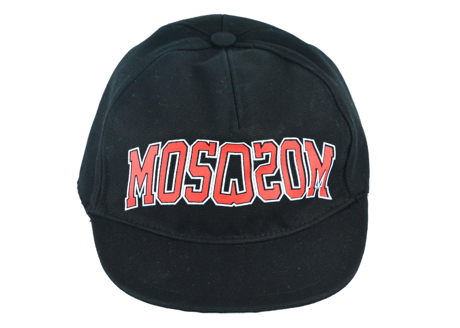 Moschino all black varsity logo cap. This cap features an all black color with red and white varsity letter logo in the front. This cap is perfect for an everyday wear and fits comfortably around the head. Pair with regular denim and an oversized
