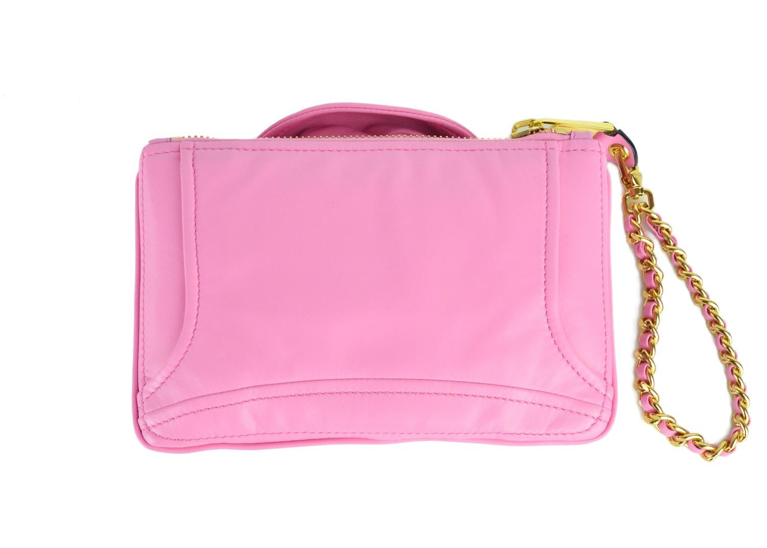 Moschino's iconic pink leather moto jacket in the form of a wristlet bag. Super chic and cute for a pop of style in your everyday look. Pair it with a classic white blouse denim jeans and nude heels for this bag to pop.

Leather
Approximately 9 inch