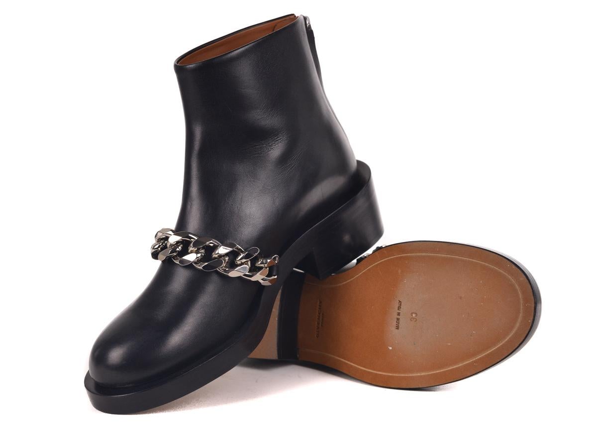Givenchy black leather Laura ankle boots. These boots feature a silver chain accent on a ankle boot silhouette. Pair with a black bottom and basic white top for a edgy chic look.

Black leather Laura chain detail boots
Round toe
Back zip