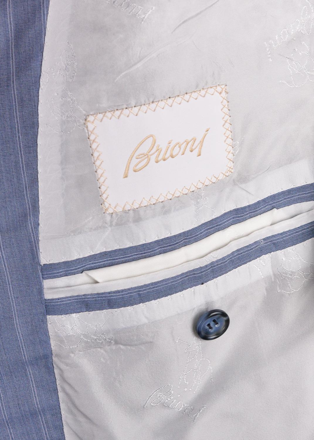 Honor yourself with the exquisitely tailored Brioni Senato suit. This uniquely crafted blue suit features the classic white based pin stripes, marble blue tonal buttons, and complimentary notch lapel. Brioni's harmonious blend of silk and recycled
