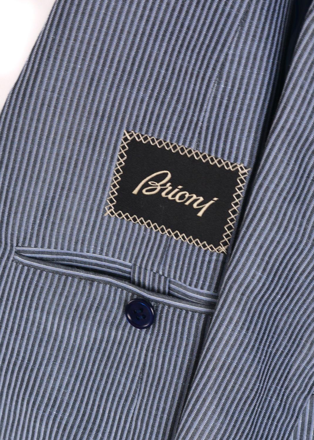 Every man should have the privilege of owning a Brioni Piuma Sportcoat. This 6000 meticulously stitched blue striped unit is perfect for that airy day event. Allow the harmonious blend of linen and silk to compliment and sculpt your frame in motion.