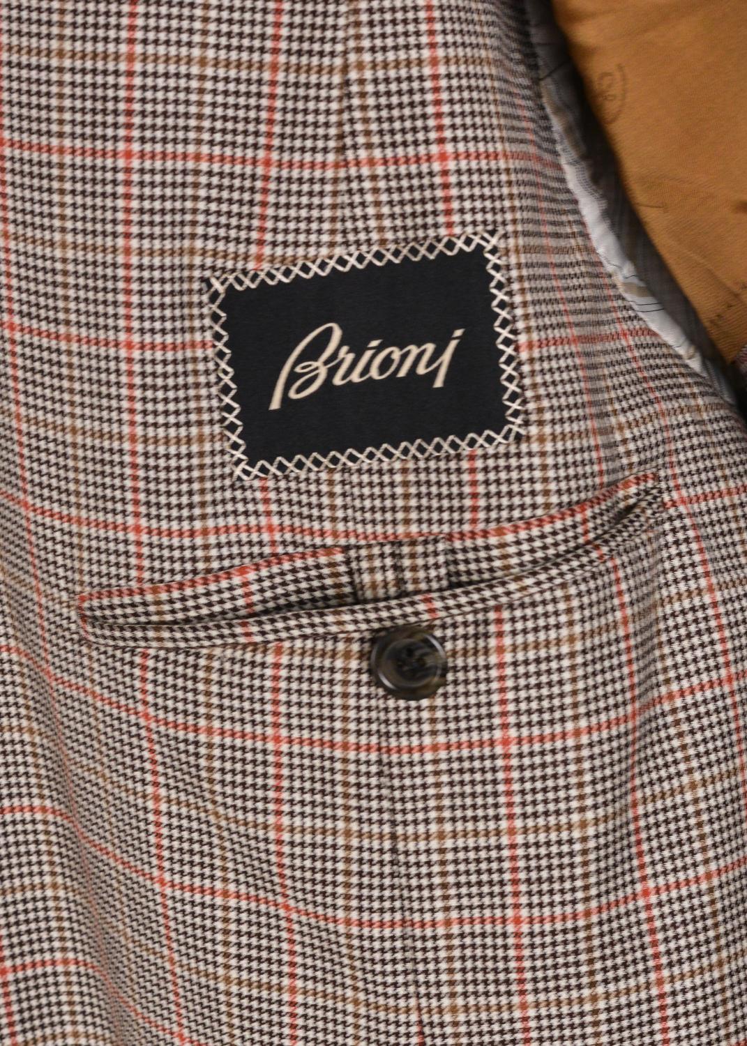 The houndstooth print will forever remain a noble classic especially when reinterpreted by Brioni. This micro hounds-tooth check sportscoat features a medley of dark brown, tan, and sun burnt orange checkered print. This sportscoat would be an
