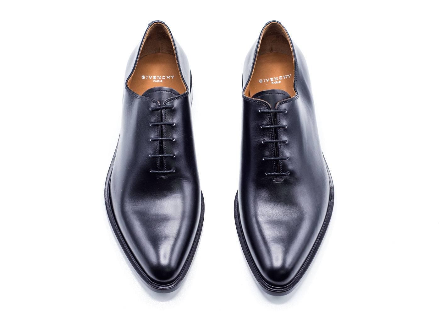 As part of Givenchy 'Prestige' line, these Oxford shoes are hand-crafted to the highest specifications in the company's manufactory. The fine black leather and clean, sweeping lines create an unfailingly elegant appearance which belies the complex