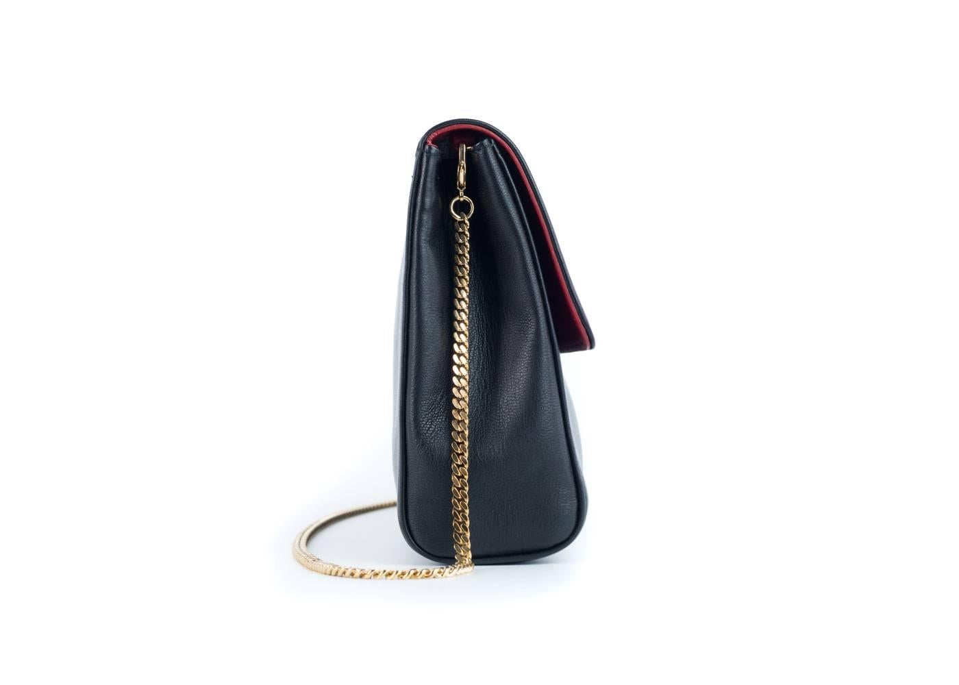 Brand New 
100% Leather Made In Italy
Long Gold Chain Strap with Magnetic Snap Closure


Black in Color with a gold chain strap, this bag fits everything you need for a night out.


100% Leather
Made in Italy
Comes with Dust Bag
Center zip