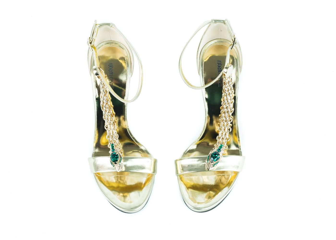 
Brand new in Original Box and Dust bag
Retails in Stores and Online $1500
Euro 36 US 6

Roberto Cavalli gold  chain & crystals sandals with ankle strap.
 Cavalli presents these chic and elegant sandal! Sassy and unique, these wonderful heels can