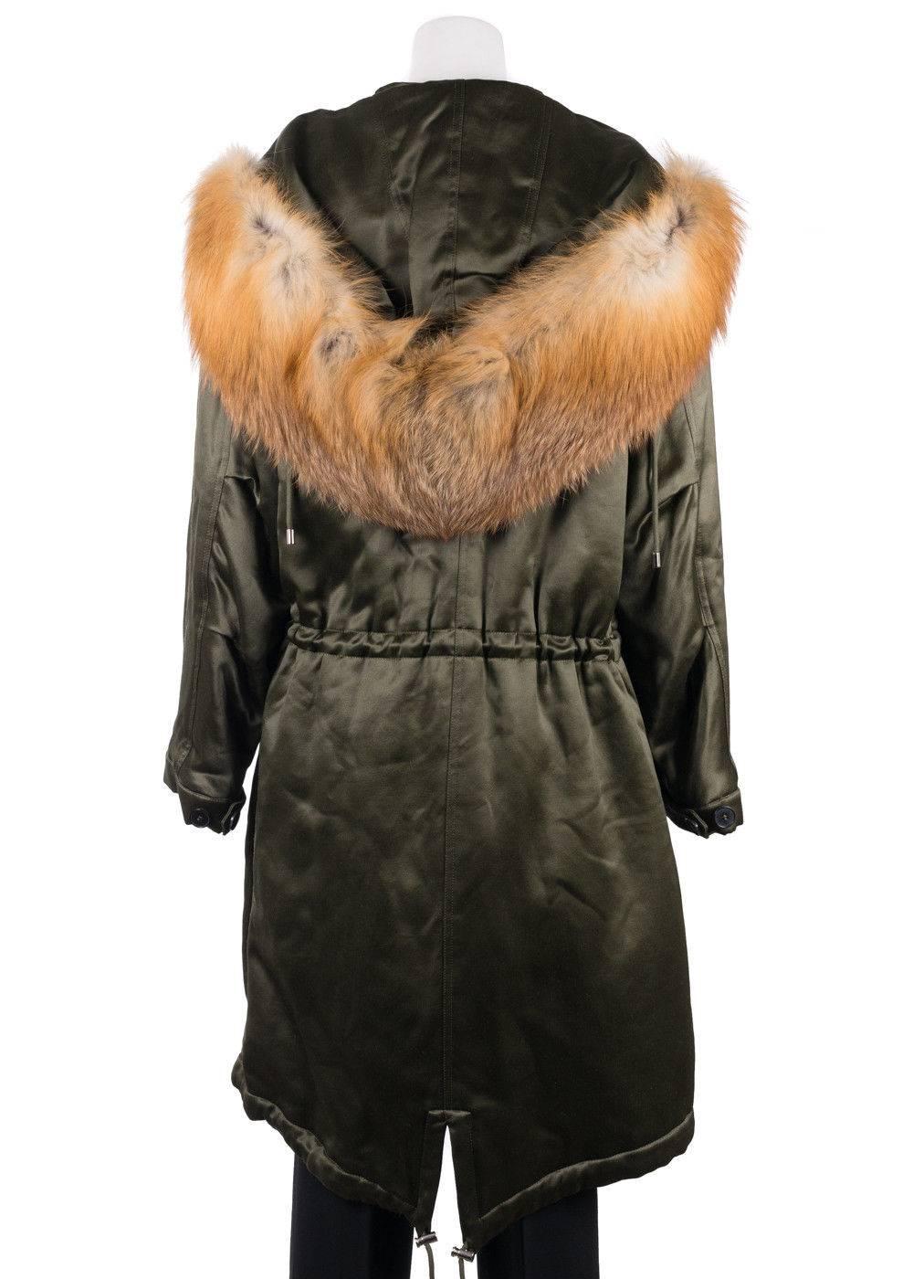 Brand New Alexander McQueen Satin Fox Fur Parka.
Original Tag
Retails in Stores & Online for $4310
Women's Size EUR 40/ US 4 Fits True to Size

Stay cozy in your Alexander McQueen Parka on the go. This satin coat was designed using fine wool