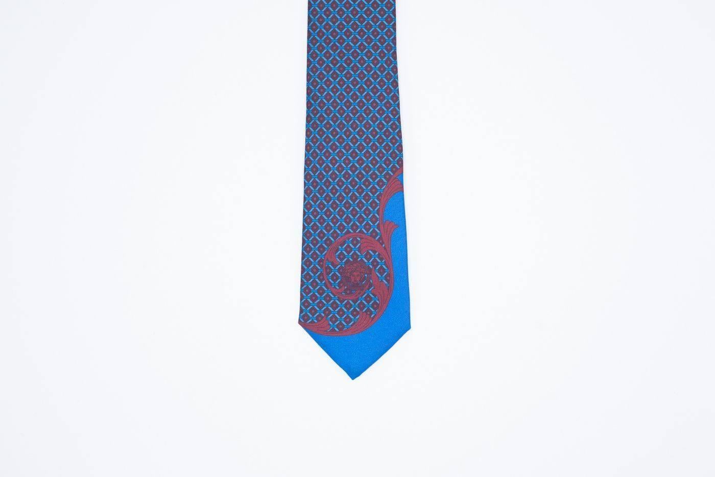 Brand New Versace Men's Silk Tie 
Retail In Stores & Online for $175
One Size Fits All

Blue and red printed geometric Versace tie. Match in style with any colored suit or button down. Made with 100% Silk, the tie is ultra soft to the touch.

Silk