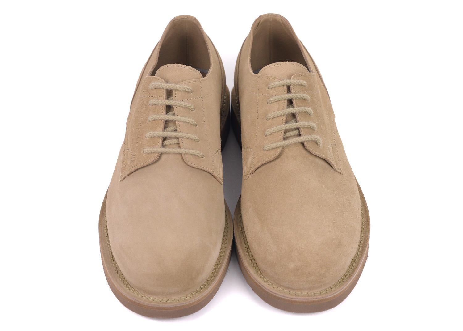 Brunello Cucinelli's Light Brown Desert Boots will be the perfect go to's for the day. This boots features smooth light brown suede, tonal fabric lacing, and tonal colored rubber sole . This low boot can be paired with a pair of light denim and a