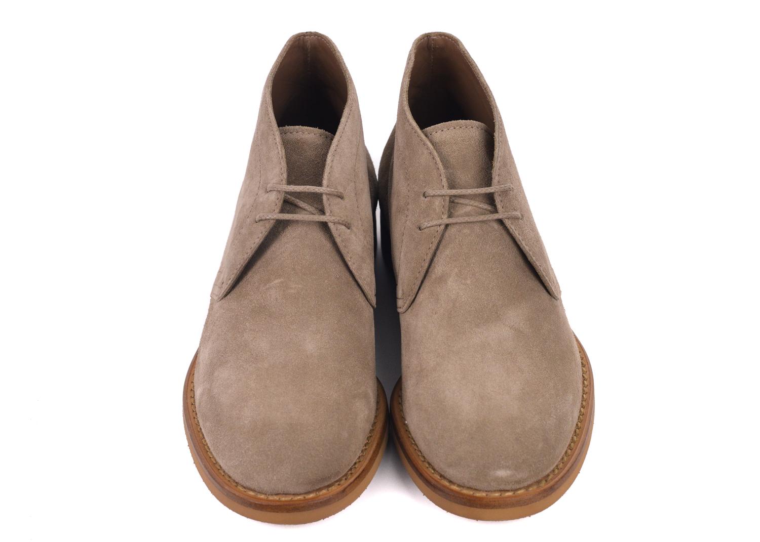 Brunello Cucinelli's Brown Desert Boots will be the perfect go to's for the day. This boots features smooth light brown suede, tonal fabric lacing, and wooden colored rubber sole . This boot can be paired with a pair of denim and a slouchy white t