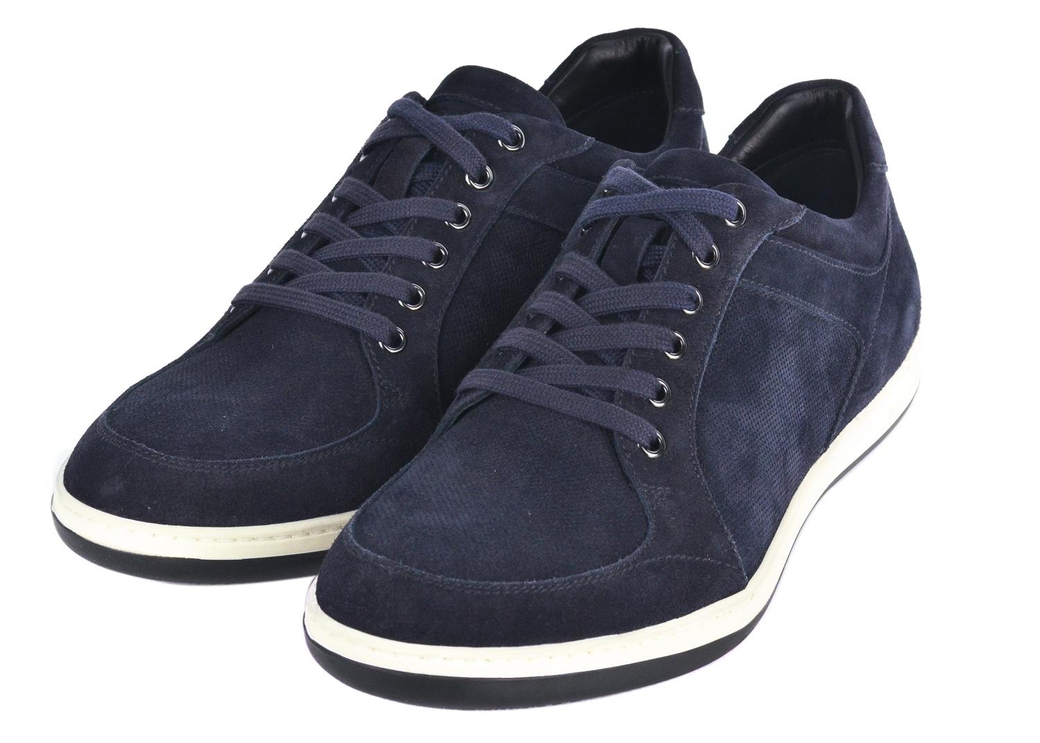 Sport your modern refined street style pair when in Giorgio Armani. These navy blue sneakers feature tonal blue laces, a thick white rubber sole, and a sleek leather black insole providing the calm edge you need. This sneaker can be paired with