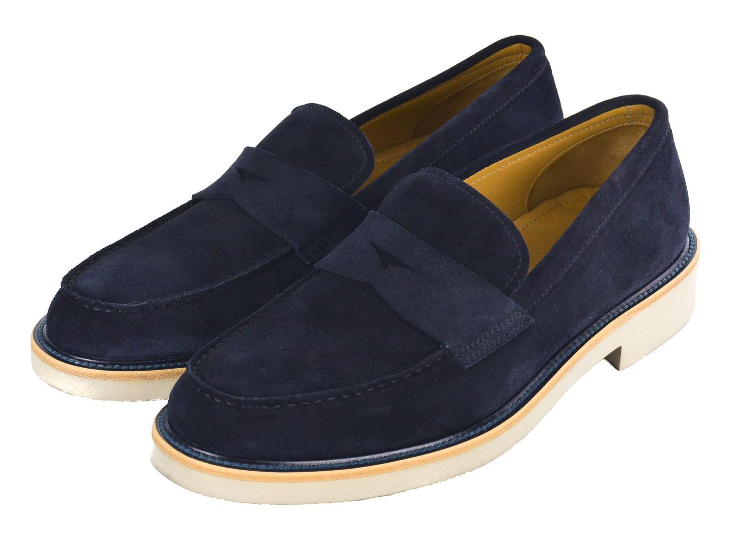 Take the time to embrace the moment in your Giorgio Armani Loafers. These shoes feature a rich navy blue colored woven supple suede, crisp white rubber sole, and classic penny par. You can pair these shoes with a dark blue blazer, crisp white top,