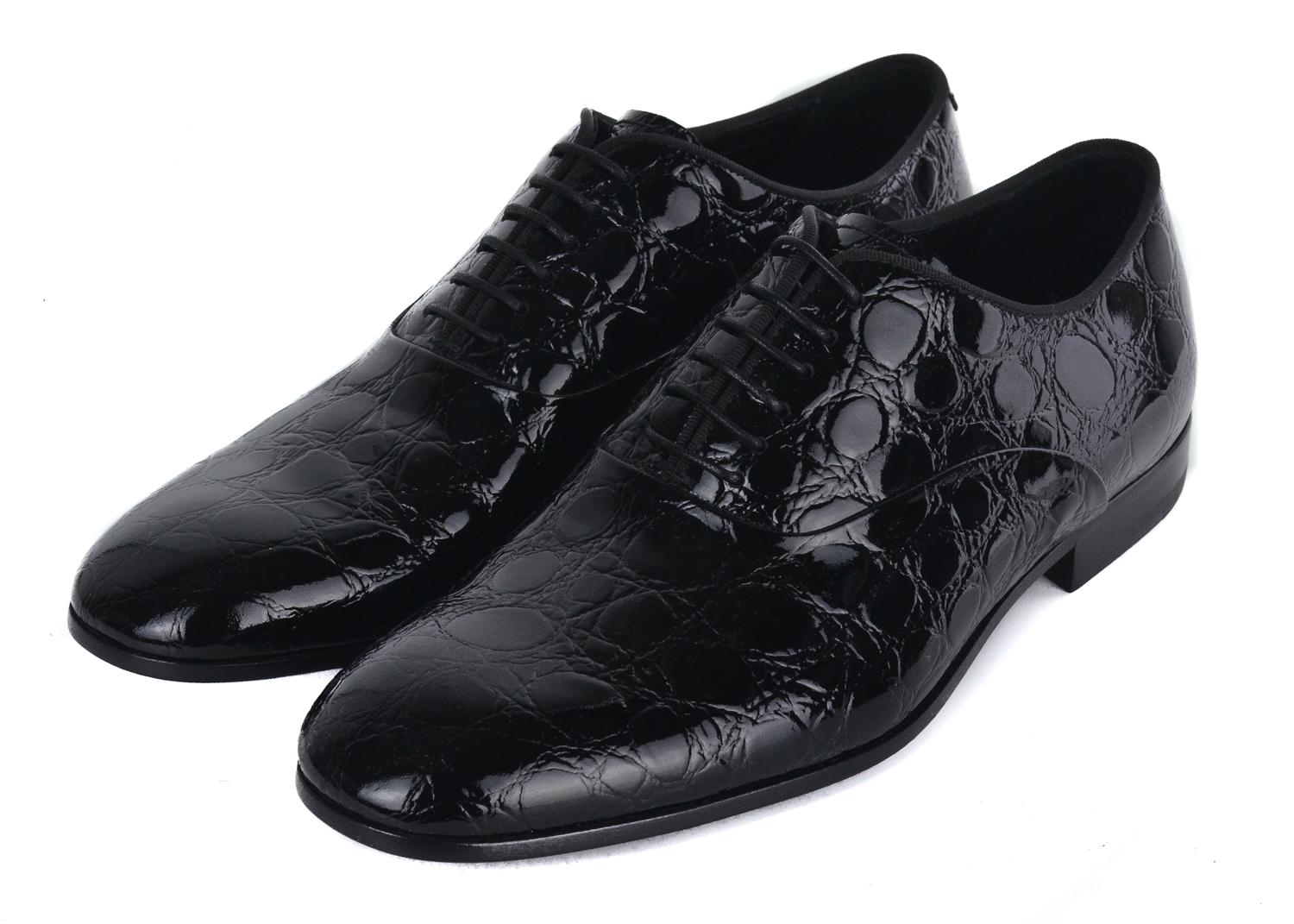 Fulfill your destiny in your striking Giorgio Armani Croc embossed oxfords. This perfectly crafted pavement masterpiece features a lux croc embossed patent leather, complimentary lace up closure, and tasteful logo engraved patent leather sole. You