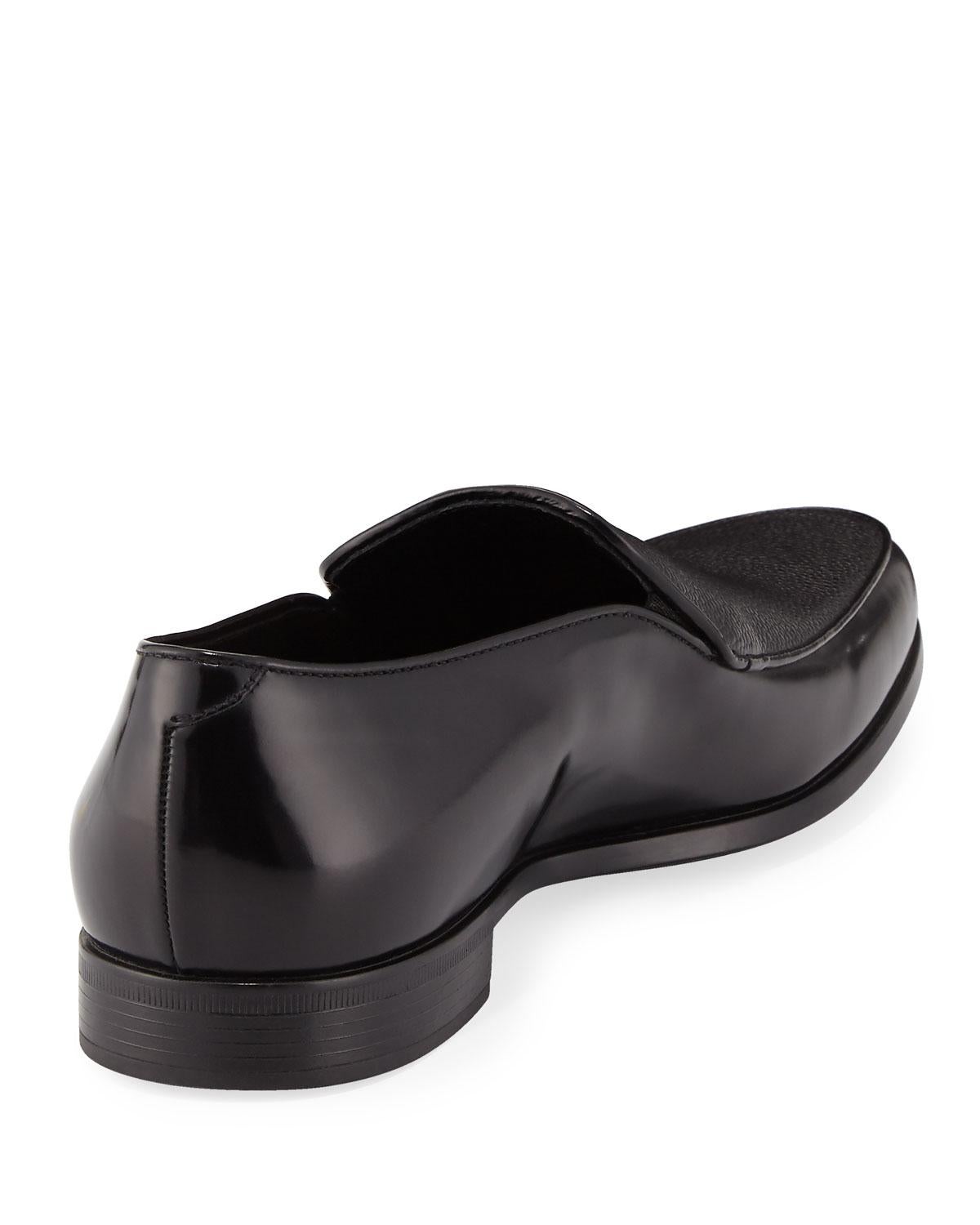 Compliment your day or night wear with Giorgio Armani's Saffiano Loafer. This shoe features patent calf leather, an upscale inspired saffiano leather vamp, with a tapered apron toe. Introduce your well traveled qualities with your Venetian vamp and