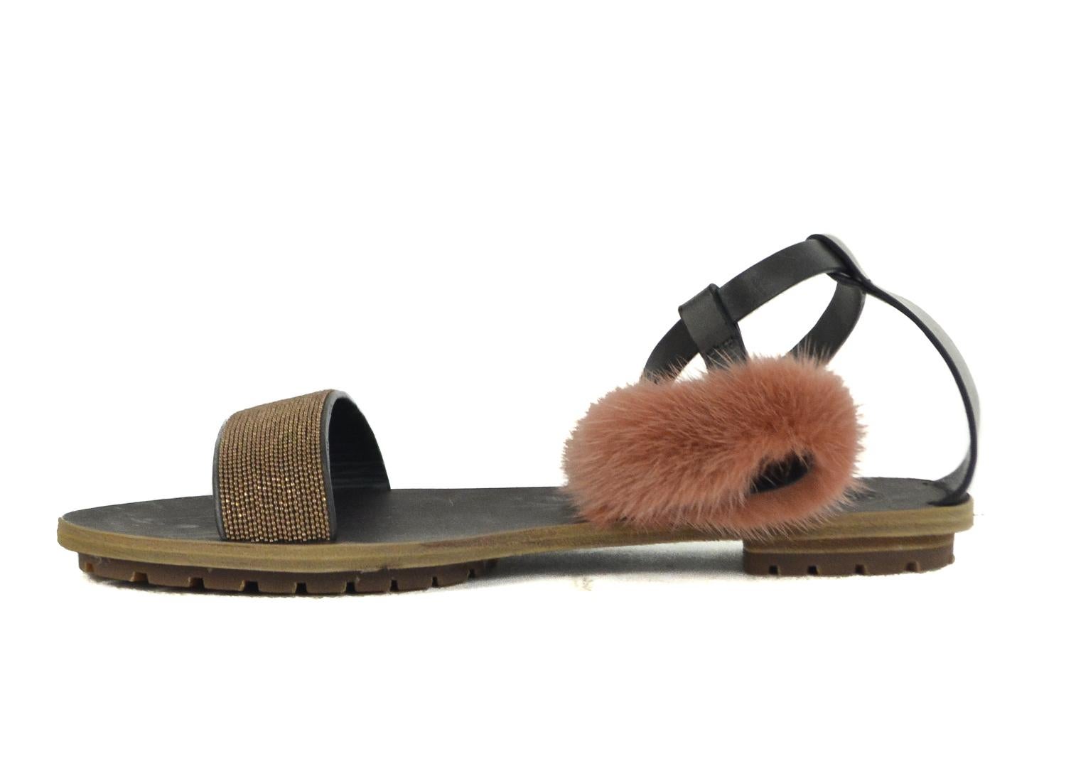 Brunello Cucinelli pink leather flat sandals. These sandals feature a mink fur detailing with an ankle strap buckle fastening. Pair it with a summer dress for a chic everyday look.



Leather
Mink Fur Detailing
Ankle Strap with Buckle