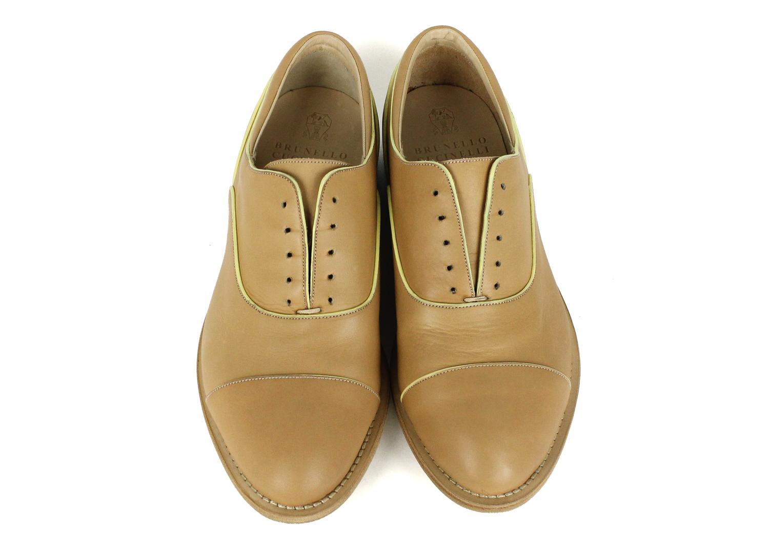 Brunello Cucinelli womens light brown leather loafers. These loafers feature lace free style with a pale yellow accented color along this classic silhouette. Pair with blue denim and white blouse for a chic everyday look.



Leather
Lace Free