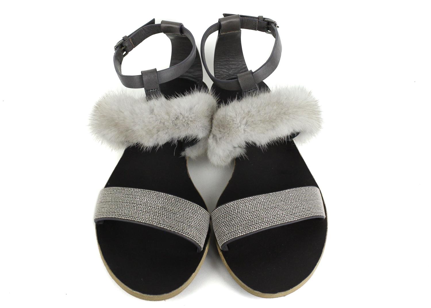 Brunello Cucinelli grey leather flat sandals. These sandals feature a mink fur detailing with an ankle strap buckle fastening. Pair it with a summer dress for a chic everyday look.



Leather
Mink Fur Detailing
Ankle Strap with Buckle