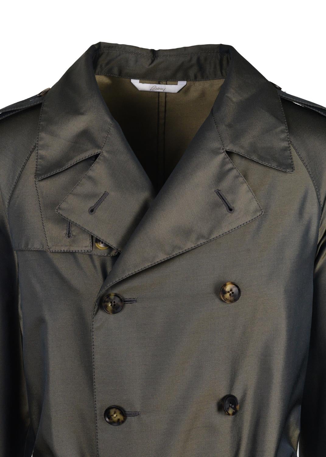 Elevate all expectations during the occasion with Brioni's Silk Blend Trench Coat. This remarkable unit features a silk thread infused water repellent fiber, double breasted closure, and classic brown marble buttons. This trench injects a slight