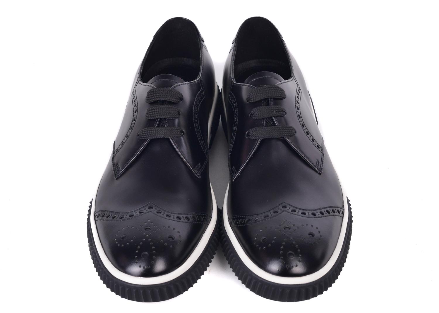 Prada lace up oxfords are perfect for that casual day  or night. This oxford features leather upper and rubber sole. These oxfords can be paired with an all dark denim outfit and a white turtleneck for the perfect autumnal feel

Linea Rossa Brushed