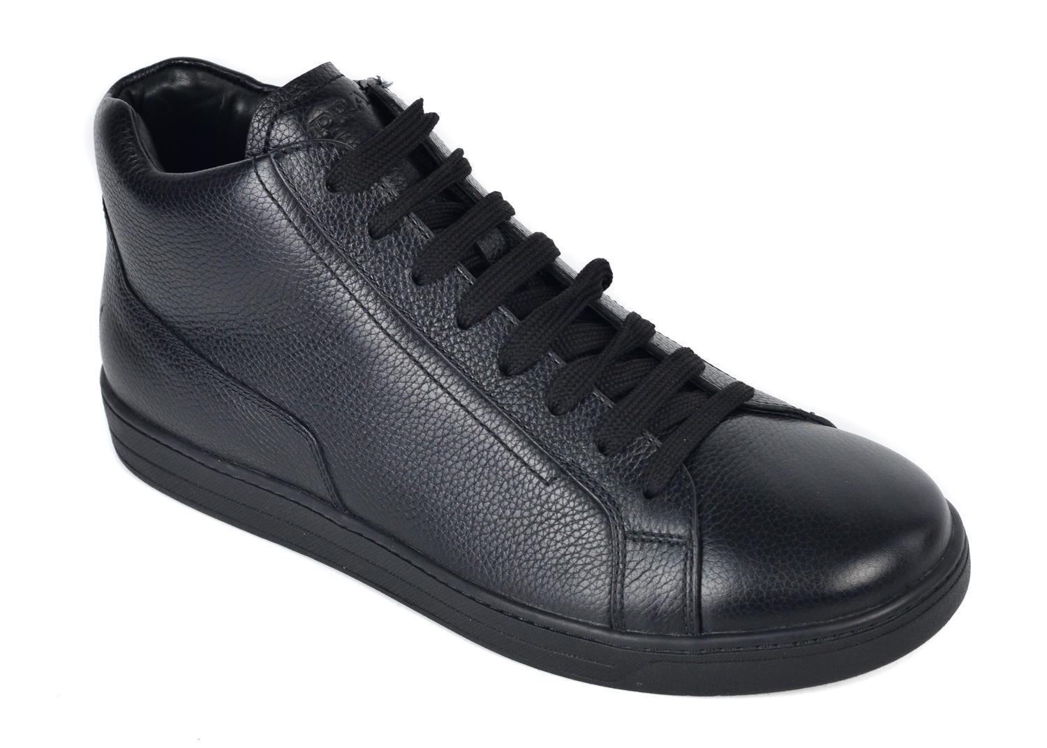 Prada is known for high quality Italian crafted leather all across the world. Add these high top sneakers to your wardrobe and compliment your globe. These sneakers feature rich polished grained leather, tonal high top lace up closure, and smooth