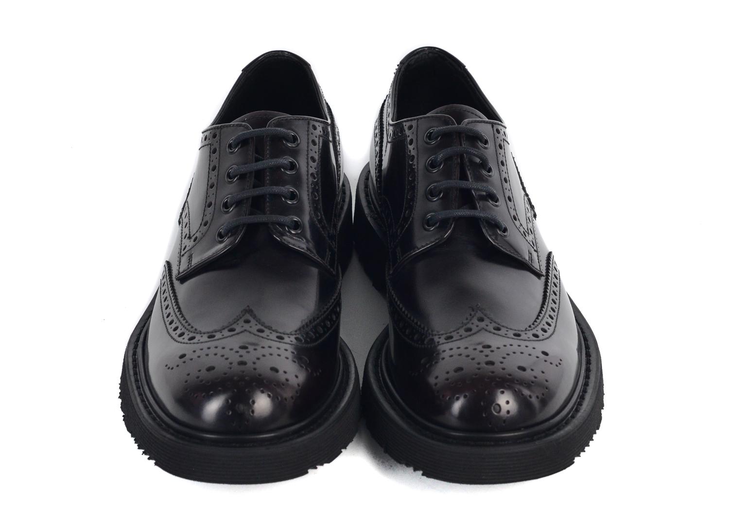 Prada's patent leather oxfords will serve as a refreshing update to your formal ensemble. This classic unit features your standard brogue pattern, unconventional patent leather combination, and 1.5 inch ridged rubber sole. You can pair these shoes