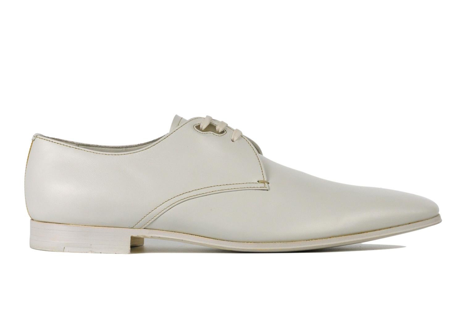 Prada - Sleek and timeless. The number one name in luxury menswear. Make your look incredible with these Prada Derby Shoes, presented in white smooth leather for an undeniably sophisticated look. Handcrafted in Italy. They are guaranteed to make a